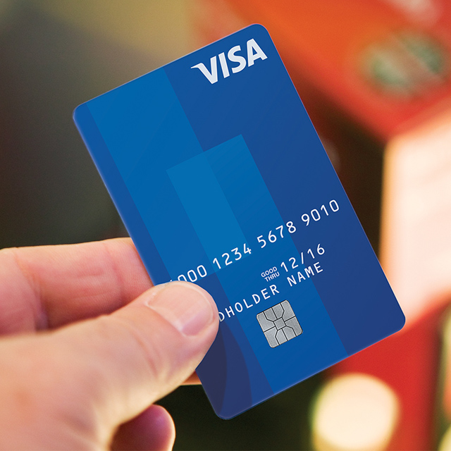 Marquee-VE-VisaCard-640x640 Man holding Visa card.