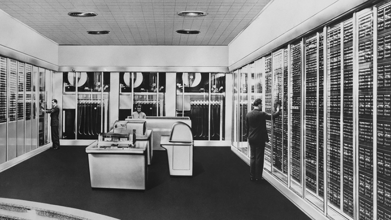 Man working in a vintage server room.