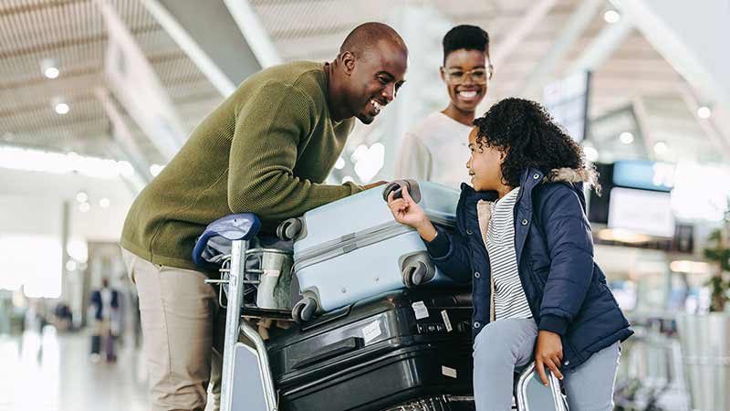 A family of tourists with their luggage